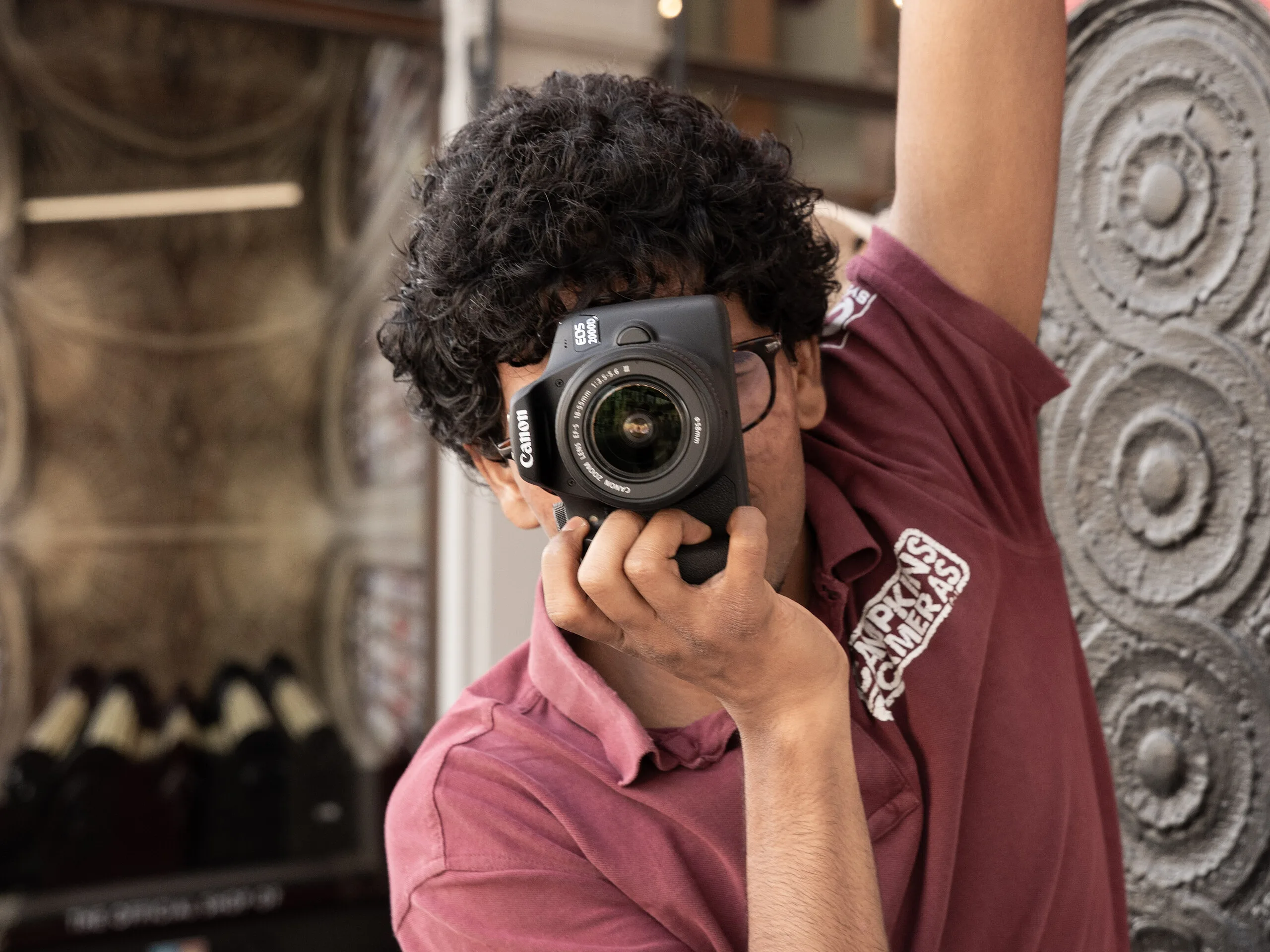 Photographer shooting with the Canon EOS 2000D prize camera in Cambridge